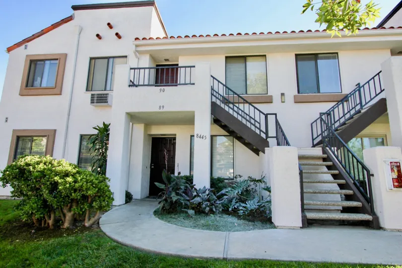 Two story residential units with attached stairways at Villas At New Salem in Mira Mesa California