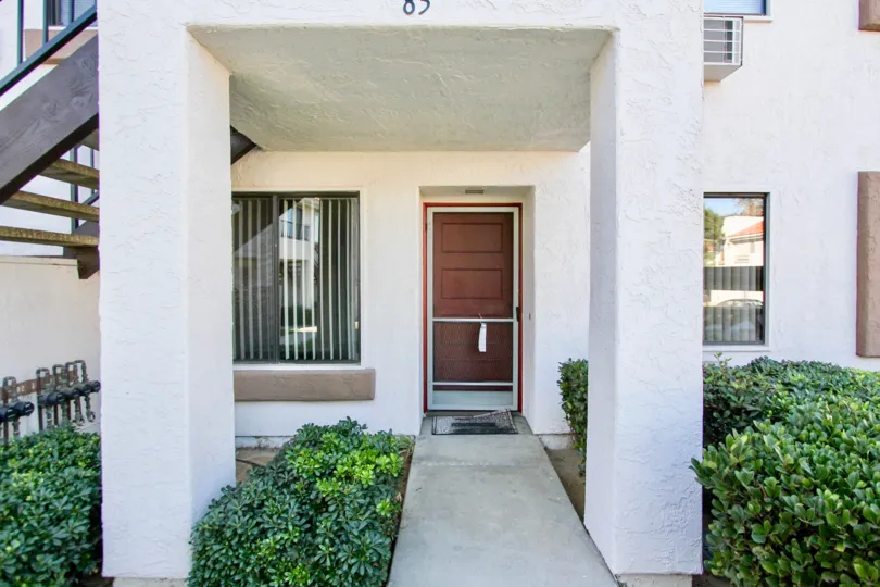 Residence with red door at Villas at Westmore in Mira Mesa California