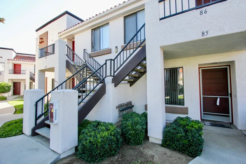 A SUNNY DAY IN THE VILLAS AT WESTMORE PLACE WITH MANY MORE VILLAS WITH STEPS AND WINDOWS