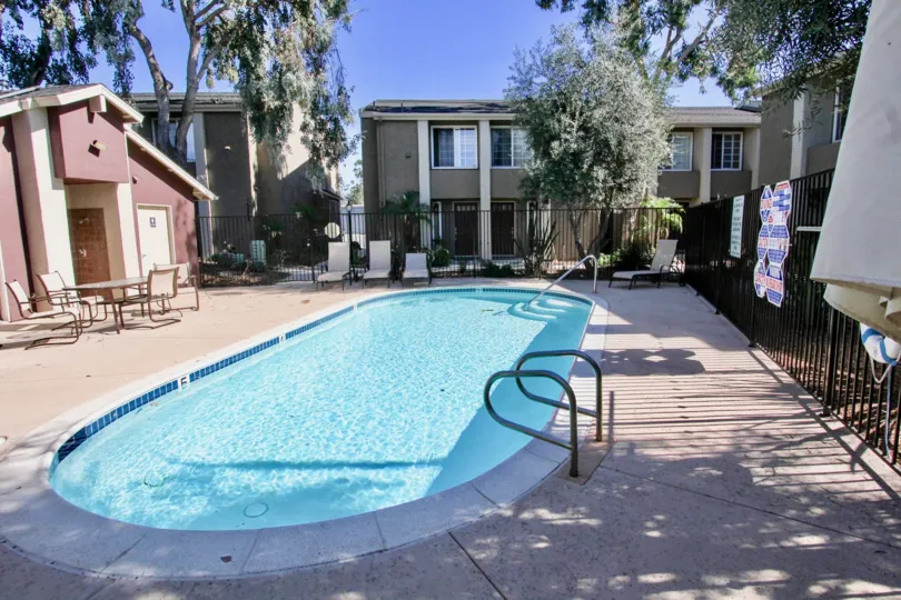 Swimming pool surrounded by residential units at Windsor Park in Mira Mesa California