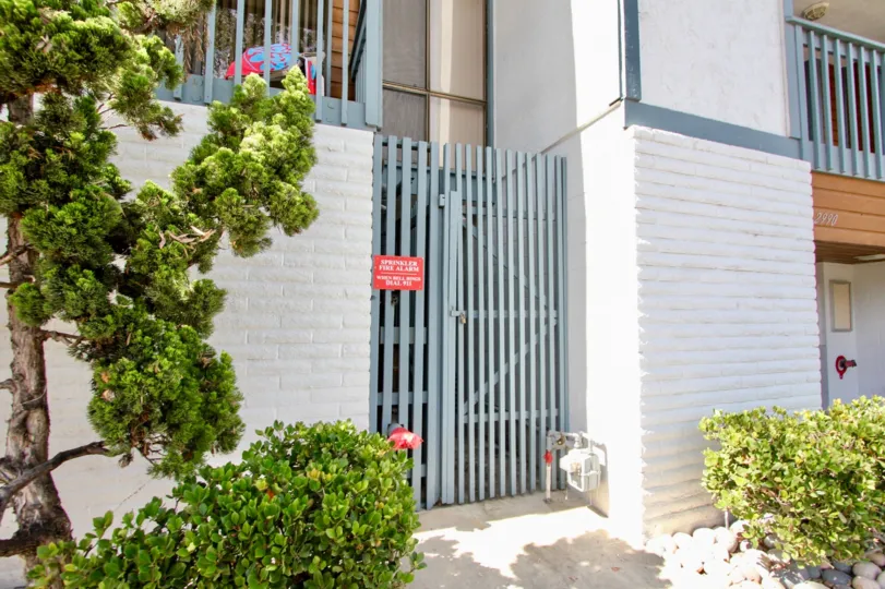 Blue fence outside the 2990 MIssion Community in Mission Beach, California