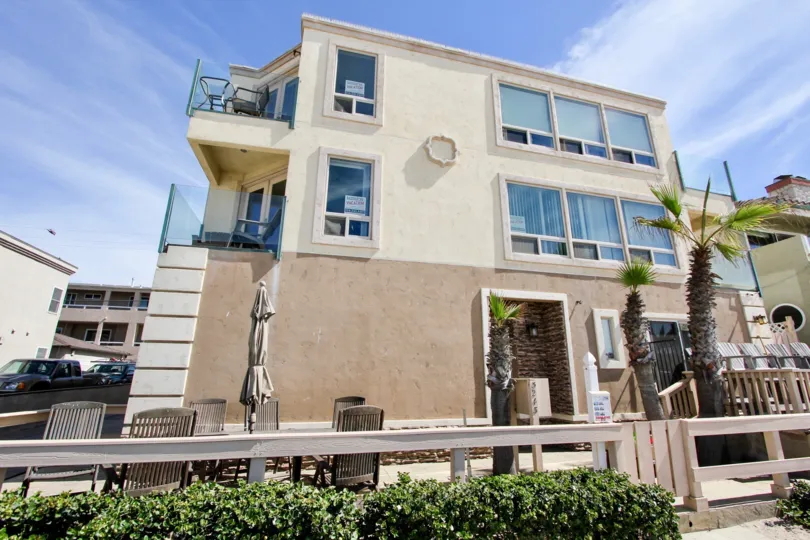A balcony overlooks a parking lot at 3243 Ocean Front Walk