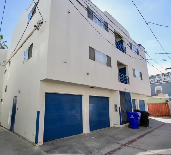 Tucked-under garages at 734 Ensenda Court in Mission Beach, California