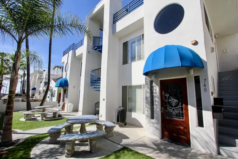 734 Ensenada Court an open condo like community with bright colors and white stone buildings
