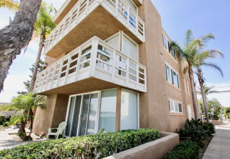 Three story pink & white condos at Bayfront Youngson in MIssion Beach CA