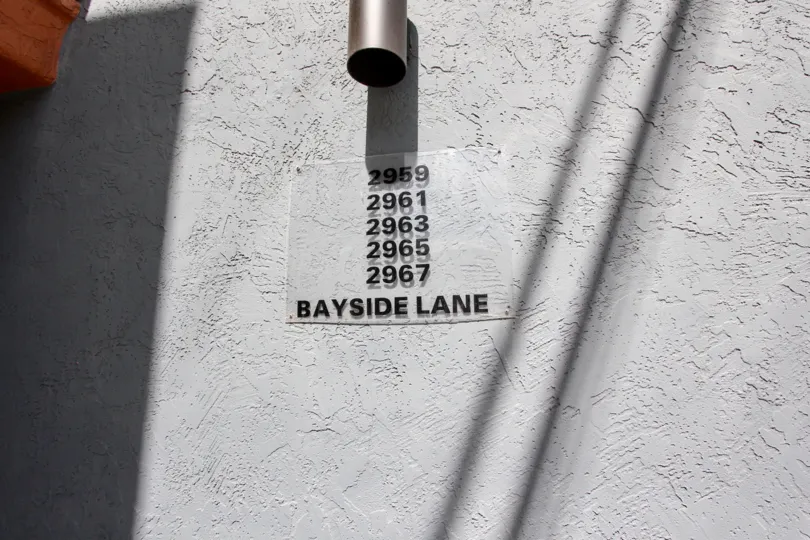 A sign with the apartment numbers for Bonita Grande in Mission Beach California.