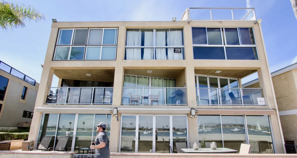 The complex and views of the building reflected in the modern villa in Mission Beach California