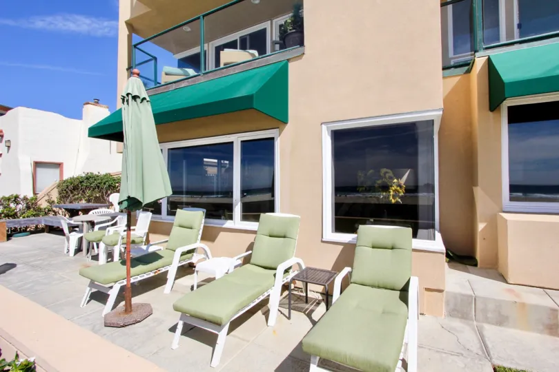 the front of beach for rest beautiful and comfortable chairs