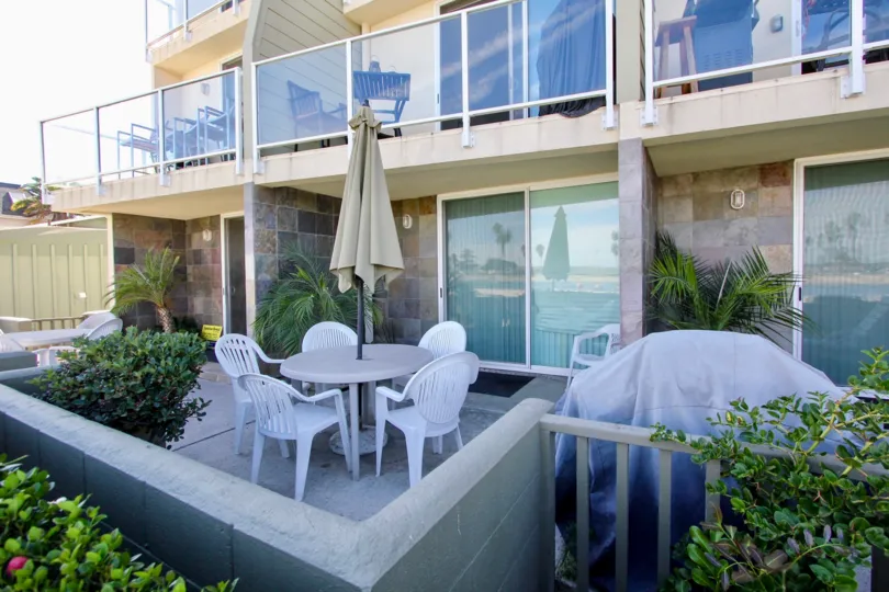 A tarp covers a grill on a terrace at Franklin Shores condos