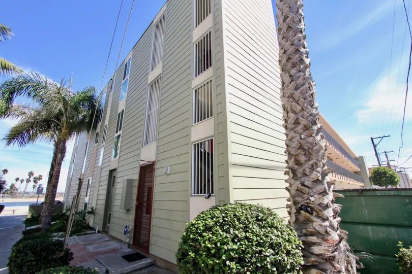Four story residential building with barred windows at Franklin Shores in Mission Beach CA