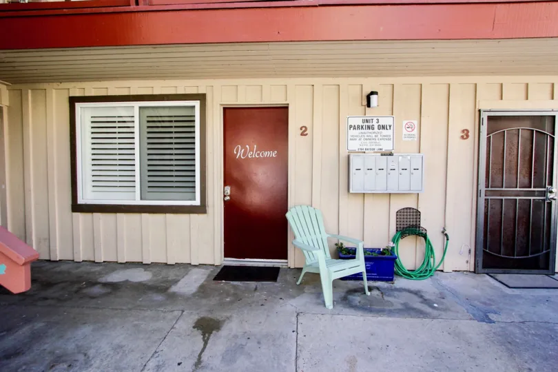 A calm and peaceful day at the Mission Beach Bayside with view of the entrance with doors and mailboxes