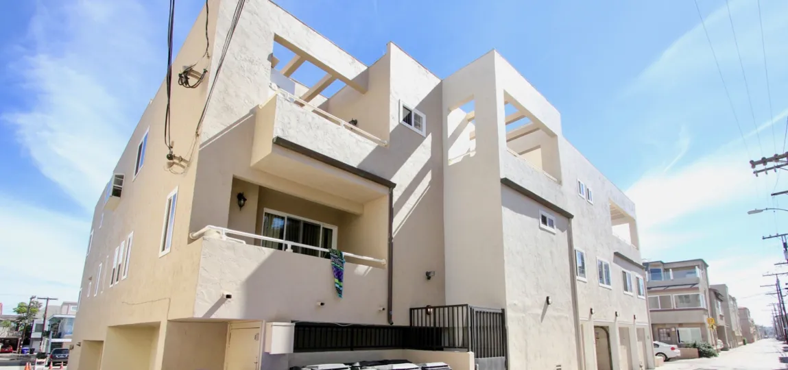 Three story white residential units at Mission Beach Villas in Mission Beach CA