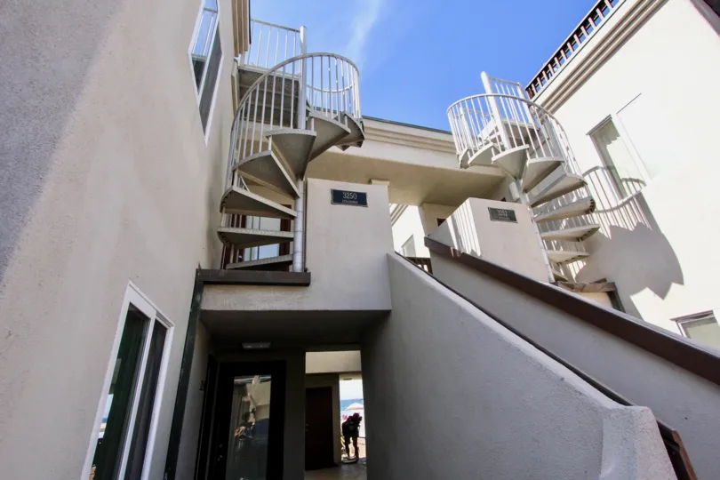 The front and spiral staircases of a property in Mission Beach.