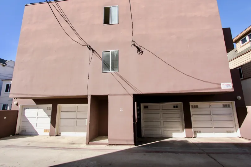 Four garage doors in the Sand Castle community of Mission Beach, CA