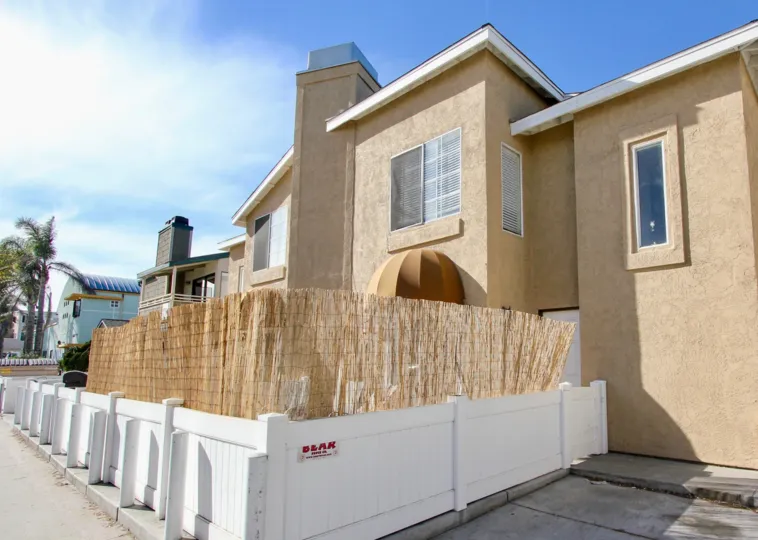 White wood fence with bamboo inside Seaburst at MIssion Beach CA