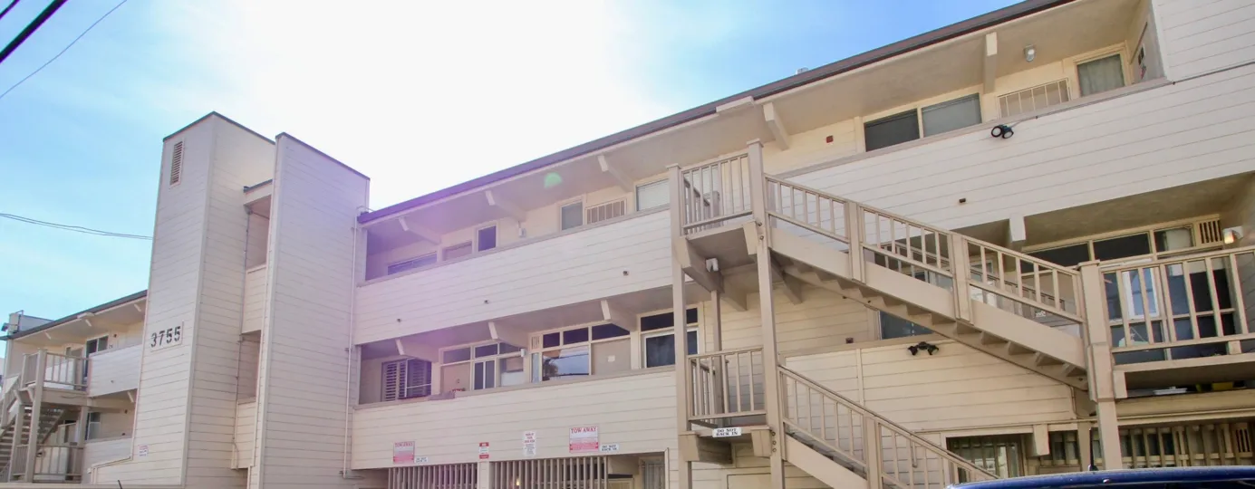 Parking lot view of the of the Beach Apartments in Mission Beach, California