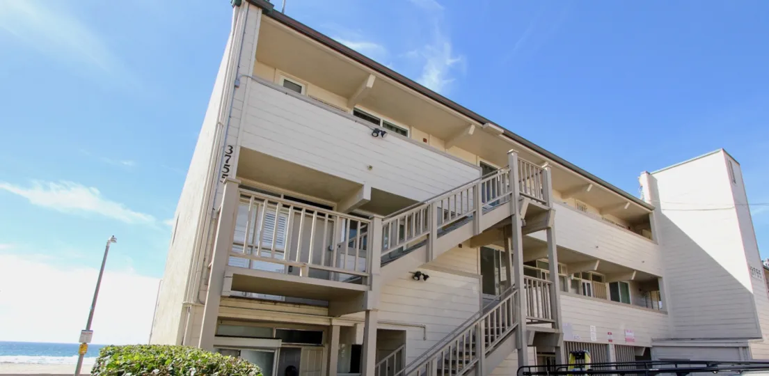 White apartment complex with staircases, Top of the Beach Mission Beach CA
