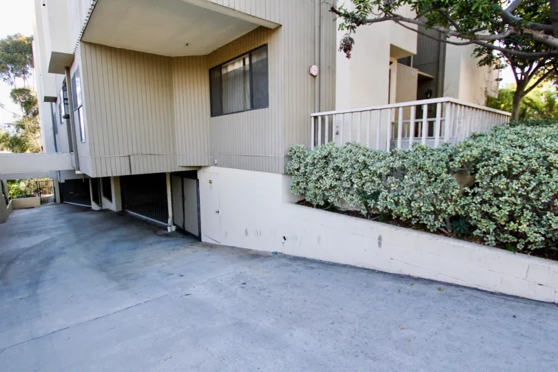 4055 Eagle apartment unit in Mission Hills, CA. Contains sloping driveway to two garages. Sunny day.