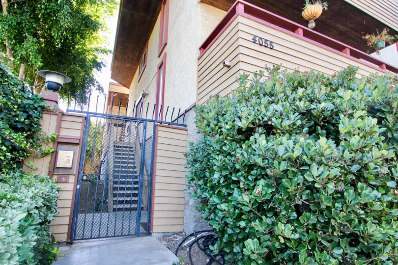 Blue iron security door with iron rods outside 4055 Falcon in MIssion HIlls CA