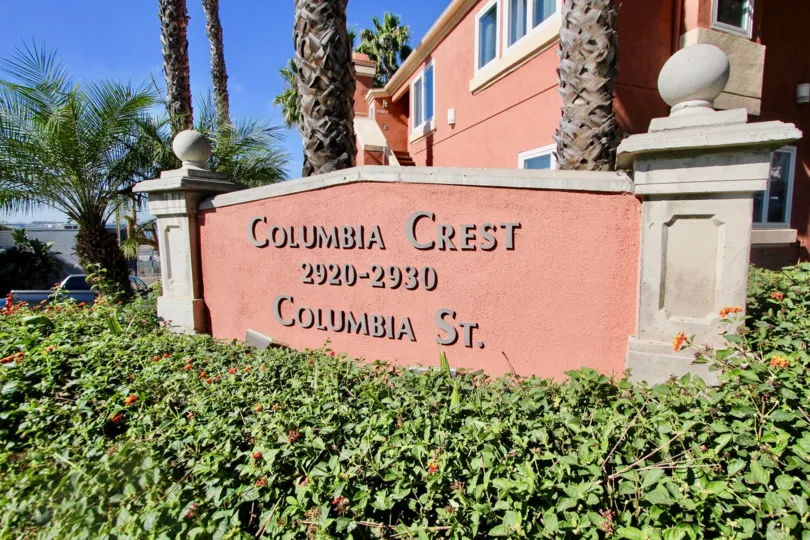 The wall surrounded with bushes and trees has Columbia Crest 2920-2930 Columbia St. at city Mission Hills