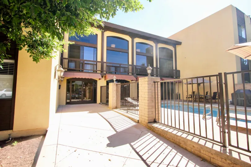 A sunny day in the area of Eagle Canyon, pool, fence, entrance balcony