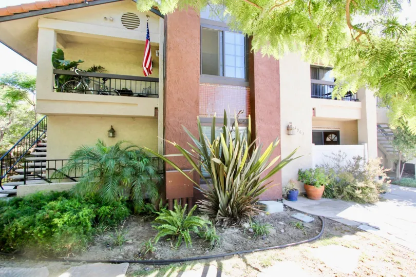 Sun-filled multi-unit apartment complex with a beautiful yard