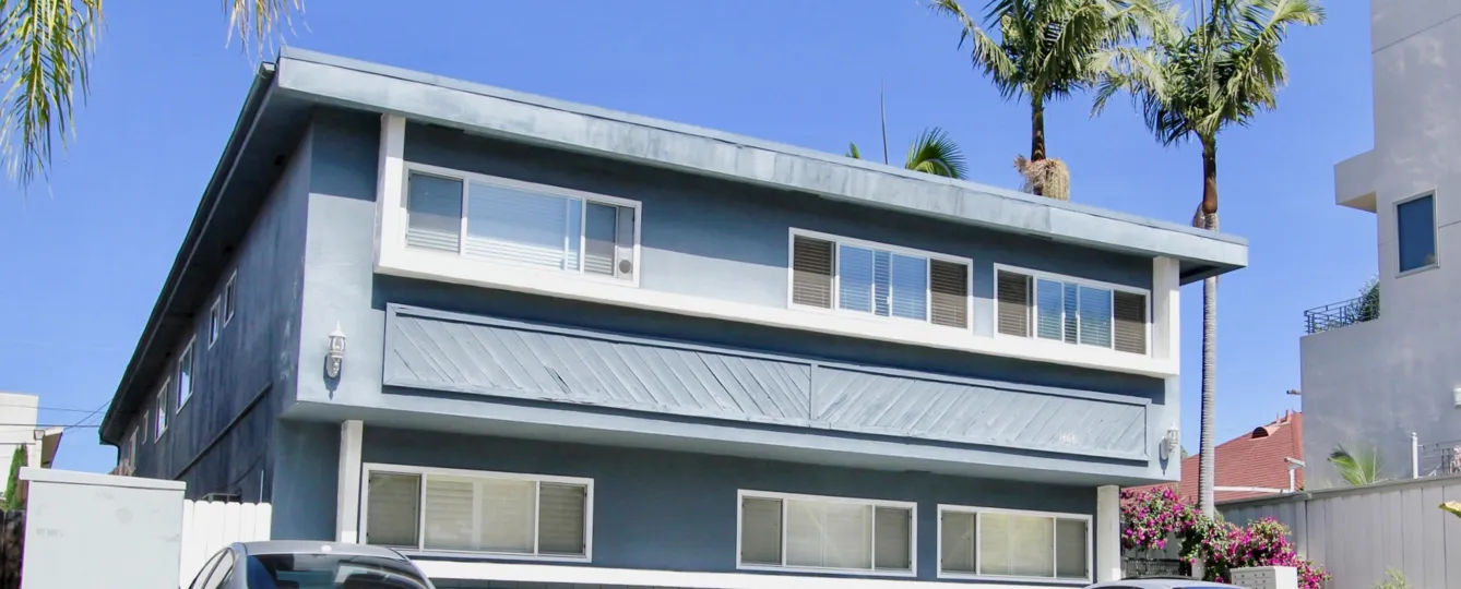 Wide frontal elevation with designed windows in Essex Manor.