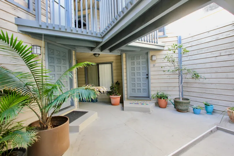 A balcony above an enclosed patio at Harborview Terrace