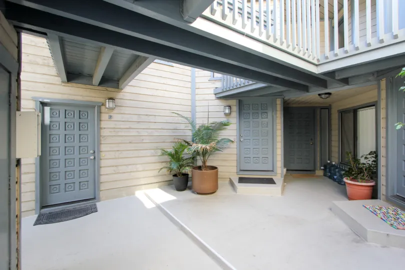 Doors to apartments inside of a complex in the Harborview Terrace in Mission Hills, California