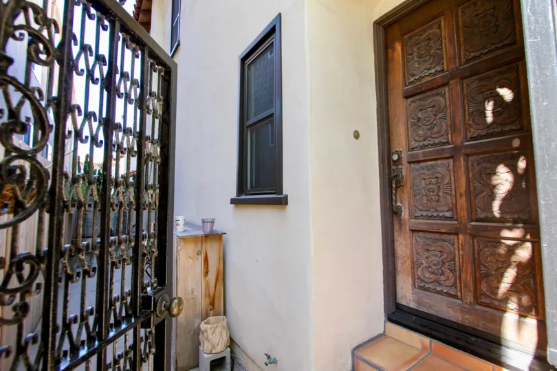 View of a beautiful wood door with several decoration in there in the Las Casas De Juan