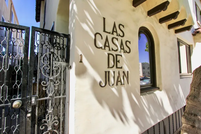 Front of a residence with label in wall in the Las Casas De Juan