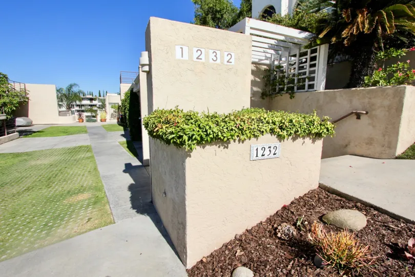 Path way of the Redwood Condominiums marked number with 1232 and has meadows