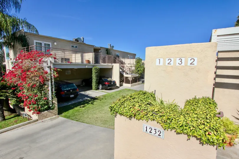A beautiful afternoon at the Redwood Condominiums in Mission Hills, CA with green grass and sunny skies!