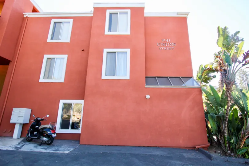 Sunny day at a peach coloured house in Mission Hills, California.