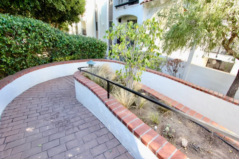 A sunny day in the area of Villa Bahia, Gated entrance, driveway, condo, brick entrance