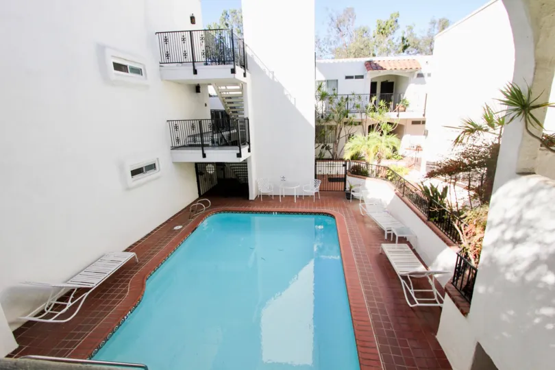 Indoor swimming pool with archway and relax sun bath chairs in Villa Bahia.