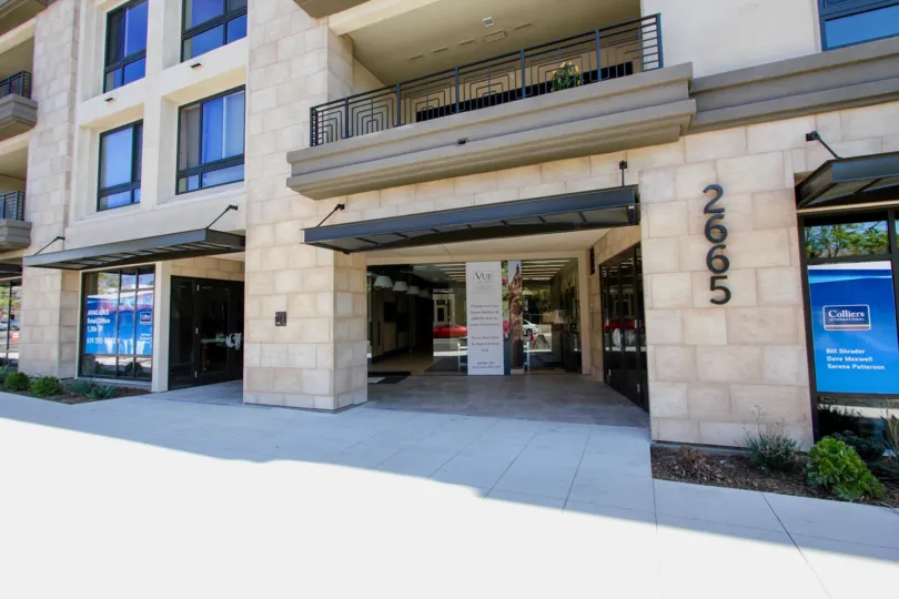 classy building entrance of the Vue on 5th, storefronts and condos above in mission hills california