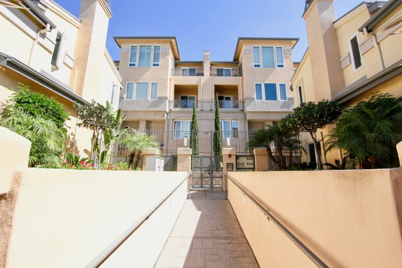 Front view of a large luxury apartment complex in Wellington Square