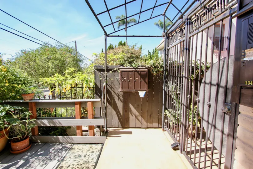 In the Entrance of the villa in the West Walnut has flower pot and with postal box