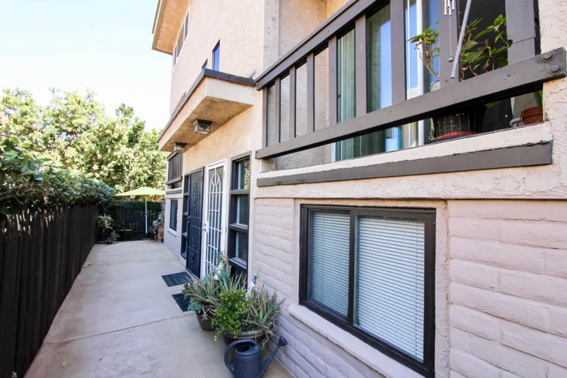 A balcony is seen above a walkway on a building at the West Walnut residential building.