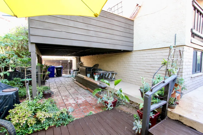 Yellow Umbrella is hanger on the table and with dustbin boxes of the Villa in West Walnut