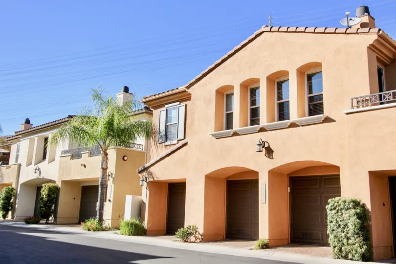 Rust colored stucco building in the Bungalows at Escala in Mission Valley, CA