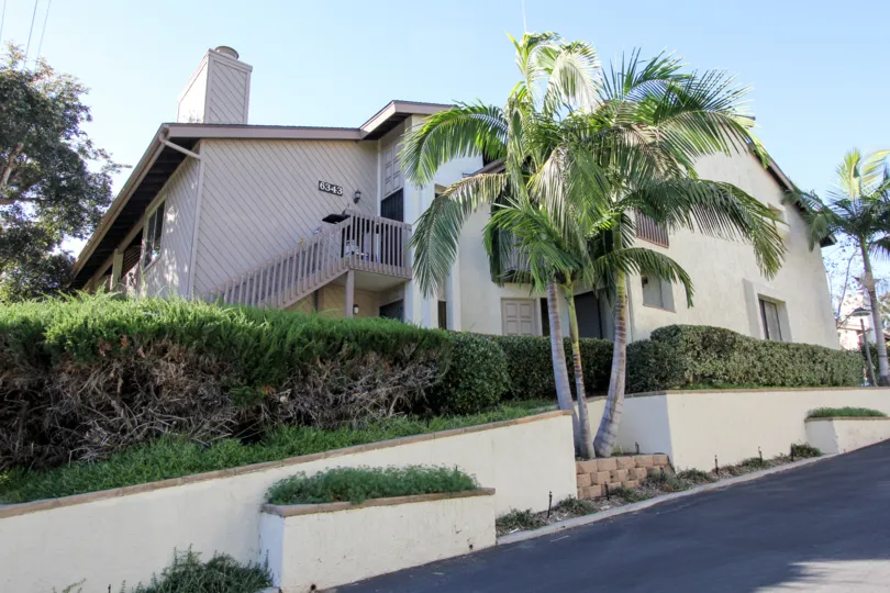 A spacious, modern house with a porch and palm trees in Cerro De Alcala, Mission Valley, California