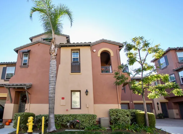 A yellow fire hydrant sits in front of a townhouse at the Courtyards at Escala.