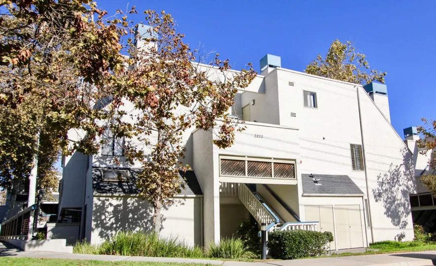 A modern, white home in Creekwood at River Run in the city of Mission Valley, CA
