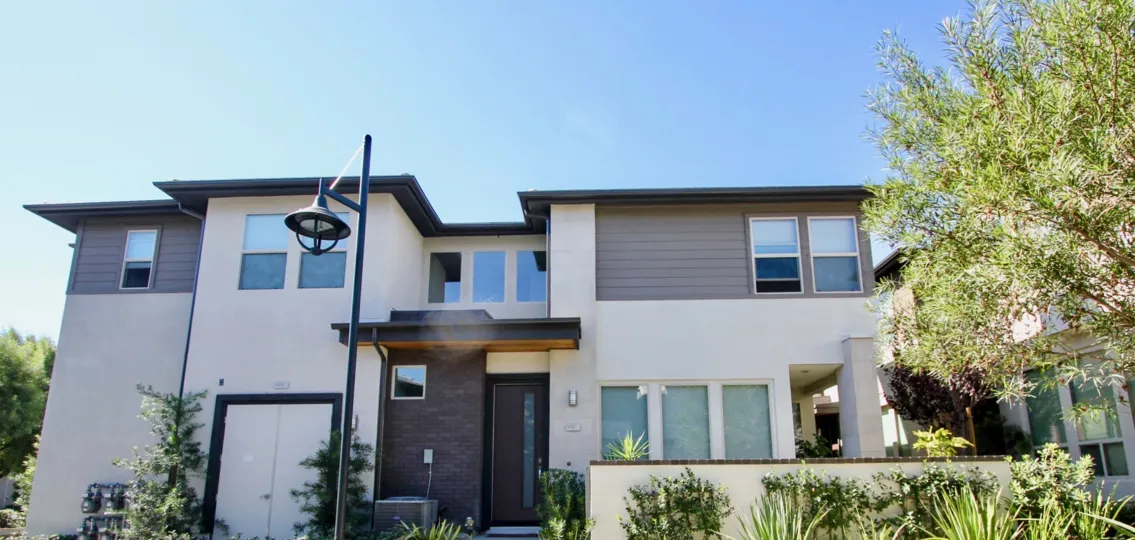 A modern street lamp sits in front of a condo at Frame and Focus