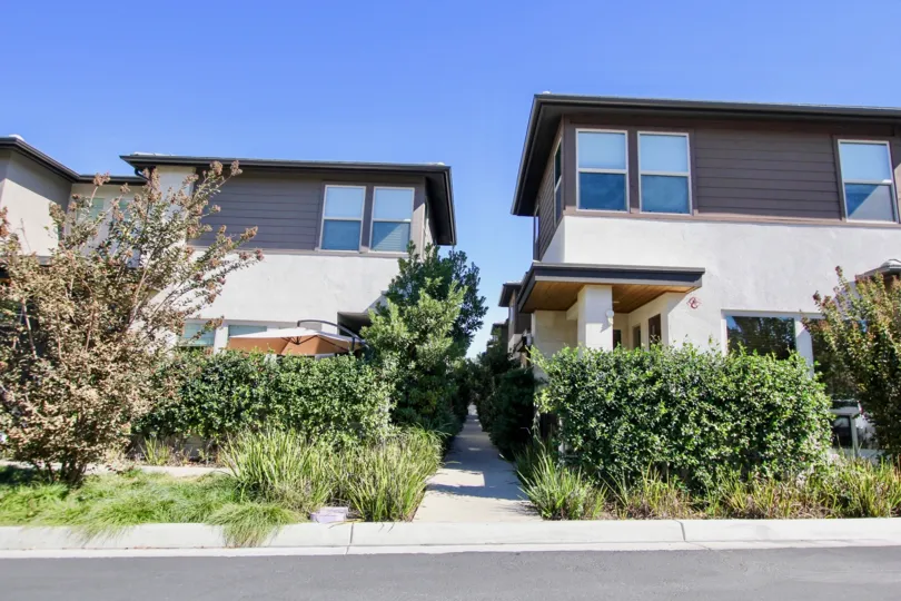 A sidewalk between two buildings in Frame and Focus community of Mission Valley CA.