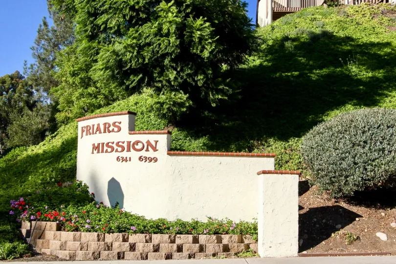 The entrance to Friars Mission is nicely landscaped with a cement sign that lists the address.