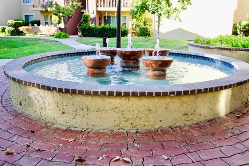A sunny day in the area of Friars Pointe, fountain, water, brick, entrance