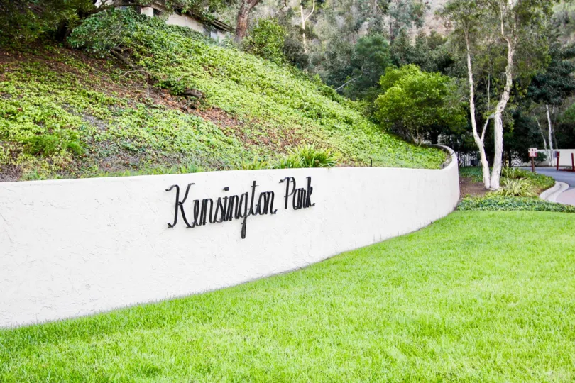 View of landscape and sign of Kensington Park Villas Mission Valley California